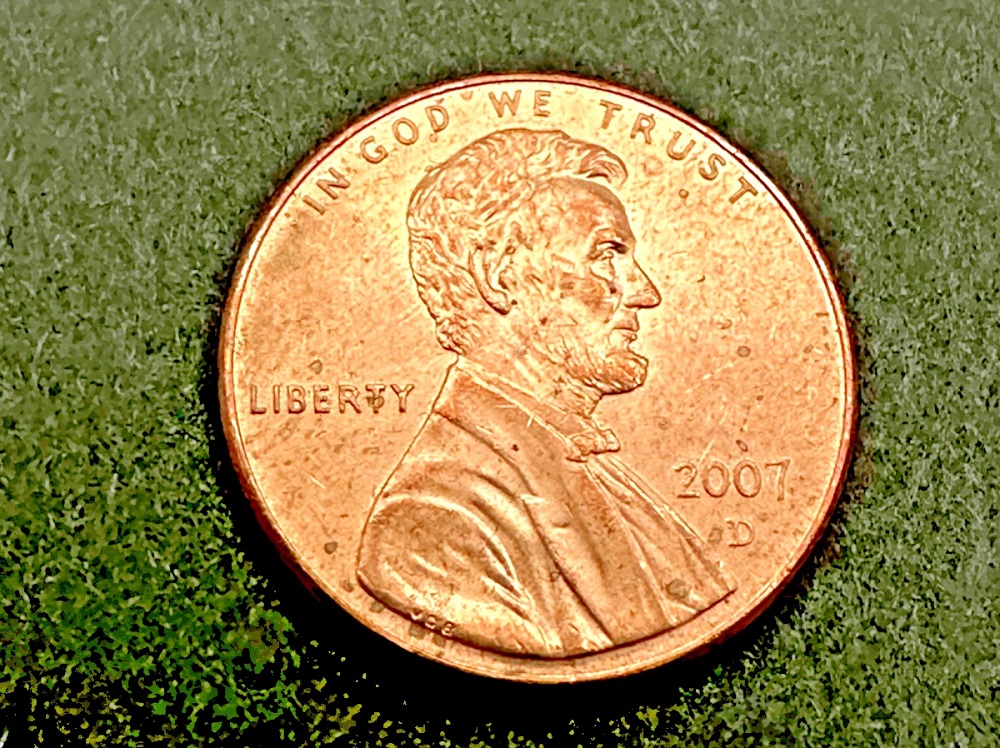 2007 penny die clash error showing ghost Memorial impression in Lincoln portrait field