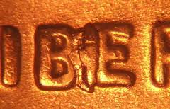 2007 penny BIE die break error showing raised blob between B and E in LIBERTY